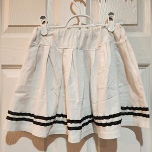 White color with 2 blue straps mini skirts